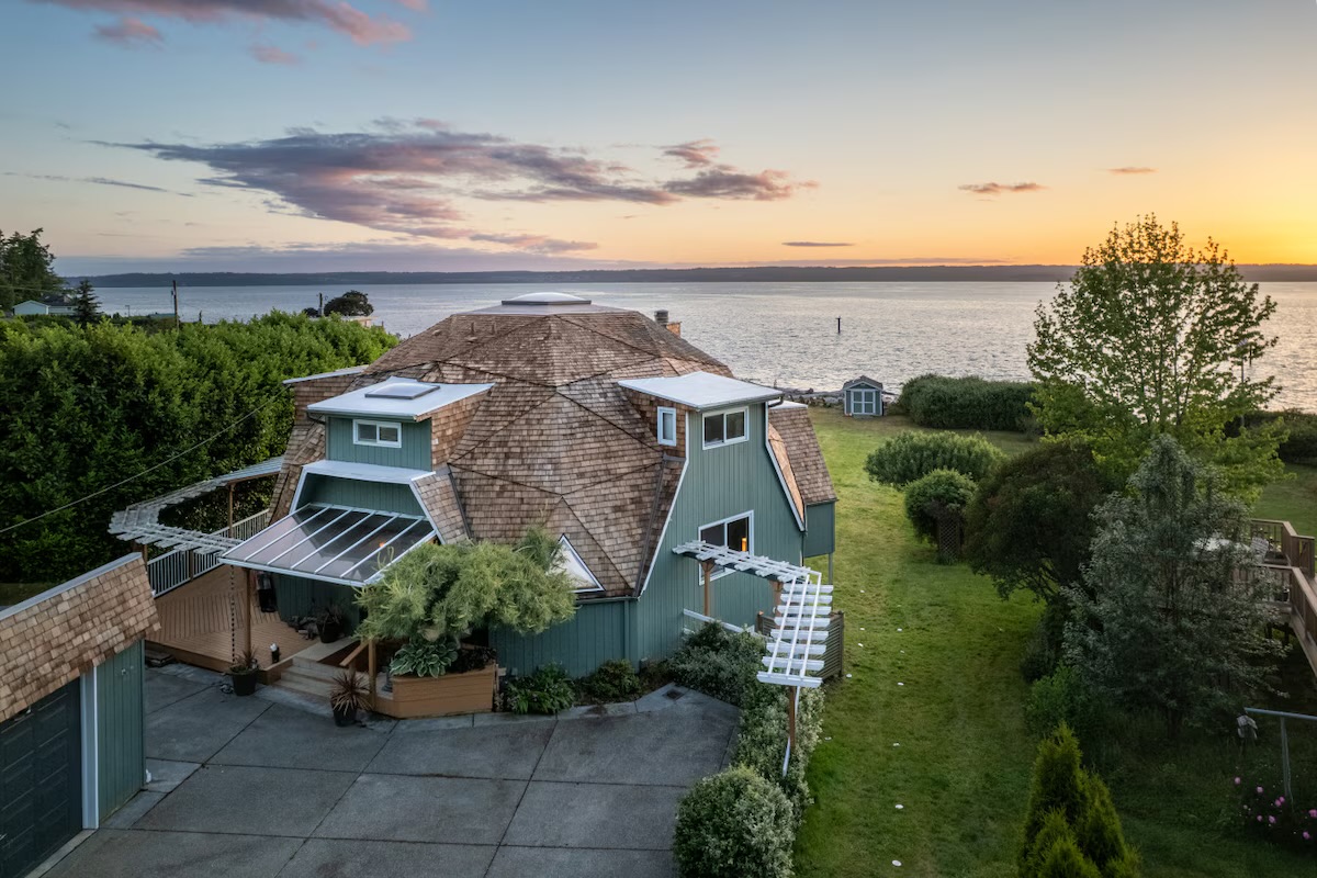 Waterfront home overlooking the water at sunset